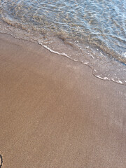 
It is a sandy beach with sea water.