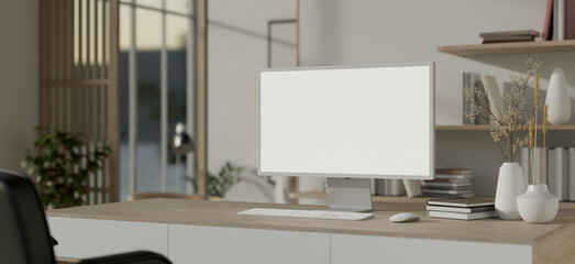 A minimalist white Scandinavian office room with a white-screen PC computer mockup on a wooden table
