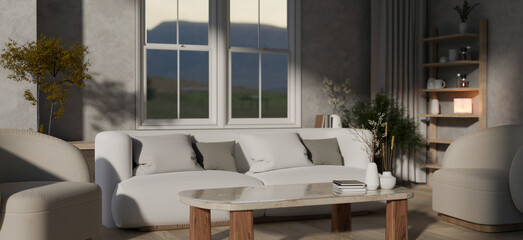 A modern, cosy living room with a comfortable white couch, a coffee table, and home decor.