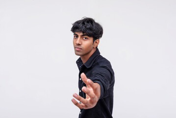 Confident young man offering hand in greeting