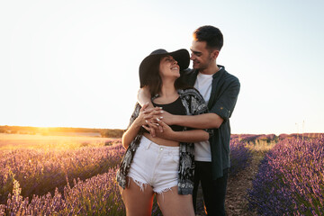 Lovely young couple in a floral field