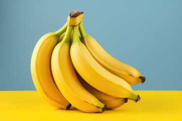 Yellow banana on coloured background still life.