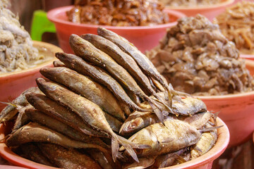 Different kinds of khmer fermented fish called prahok and pa ok sold on the local market showing the authentic traditional cuisine and culture of Cambodia