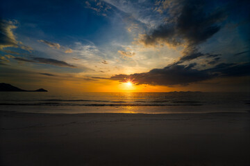 Fototapeta na wymiar Sunset on the Andaman Sea at Yao Beach west coast of Thailand, Hat Chao Mai National Park Trang Province Thailand.