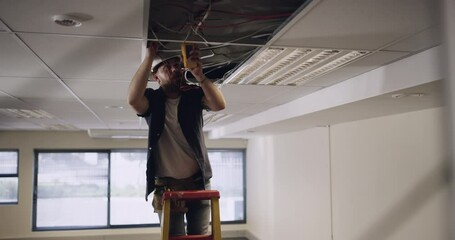 Man, electrician and light installation with construction, engineering and renovation for power supply with maintenance. Industrial, manual labor and technician, electricity and trade with service