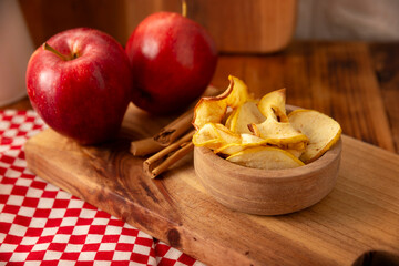 Homemade Apple Chips, thin slices of dehydrated and baked apple, sprinkled with cinnamon powder, easy recipe for a healthy snack.