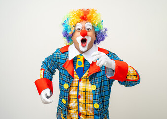 Mr Clown. Portrait of Funny face Clown man in colorful uniform standing variety action. Happy expression male bozo in various pose on isolated background.