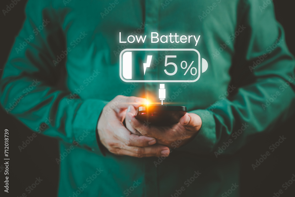 Aufkleber Smartphone out of battery. Concept of Technology and daily life. Man is angry and frustrated when he learns that his mobile phone's battery is dead and did not bring the charger adapter or power bank.