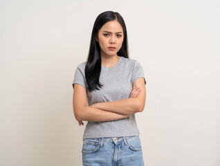 Upset confused bad emotional and thinking asian woman. Unhappy stressed female. Young latin lady standing feeling depressed dramatic scene looking at camera on isolated background.