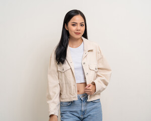 Beautiful smiling happy young asian woman age around 25. Charming female lady standing pose on isolated white background. Asian woman people looking camera confident with backdrop.