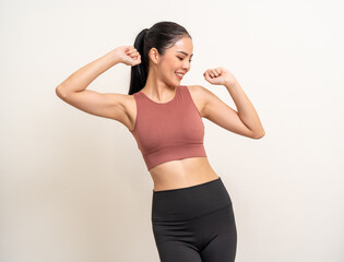 Fototapeta na wymiar Young beautiful smiling asian woman with sportswear dancing happy by her body shape feels good and comfortable. Portrait happy healthy slim fit and firm latin attractive sporty woman exercise workout