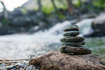 stack of pebbles on the riverbank