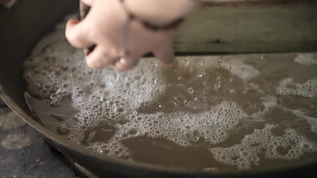 sift the palm sugar in slow motion