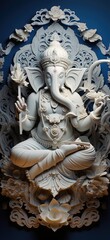 White marble statue of Hindu god Ganesha sitting on lotus flower