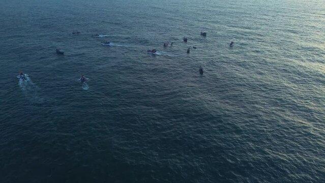Aerial view of sea landscape with fishing boats of Vietnamese fishermen catching fish in the morning. Concepts of maritime, fishery and travel.