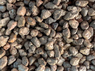 Pile of small stone pebbles or Pumice volcanic stone for background or texture.