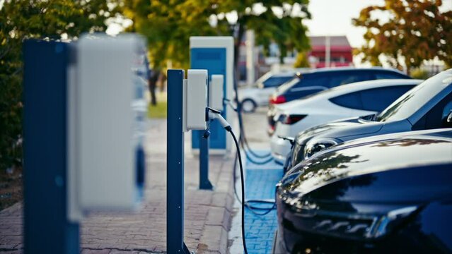 Electric cars  recharging at the charging station. ev charging station. slow motion. 4K