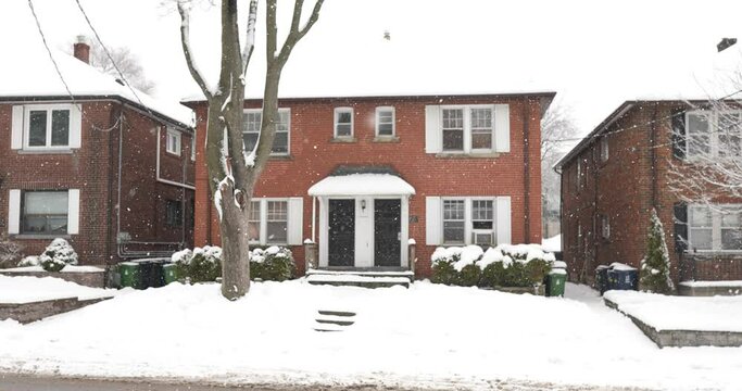 Beautiful house in Toronto, Canada during a stunning snow fall in winter.