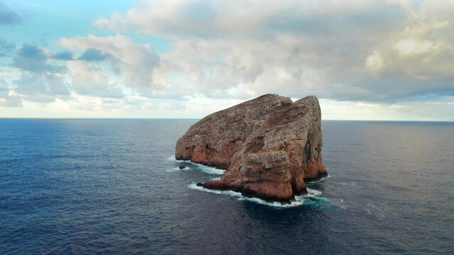 Flying towards Foradada Island from Belvedere La Foradada, Capo Caccia, Alghero, Sardinia, Italy