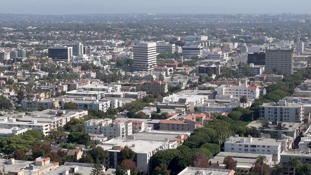 Aerial Rising Shot View Of Santa Monica Cityscape With Variety of Large And Small Buildings