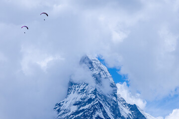 Matterhorn  Switzerland seen from Zermatt with Parapenter flying nearby.