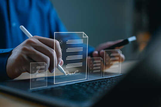 E-signing, electronic signature, document management, paperless office. Businessman signing on e document on digital tablet, virtual notepad on virtual screen, Online contract signing with application