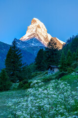 Matterhorn seen from Zermatt at sunrise when the mountain is turning golden