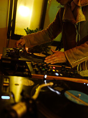 Hands on the Turntable: A Low-Light Scene
