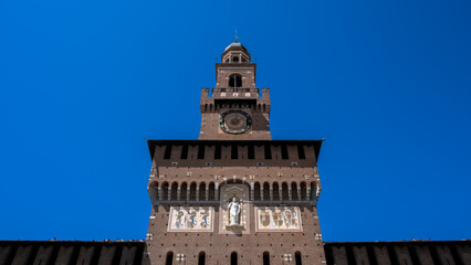 Fototapeta na wymiar Architectural detail of the Castello Sforzesco (Sforza's Castle), a medieval fortification from the 15th century, now housing several museums of the city of Milan 