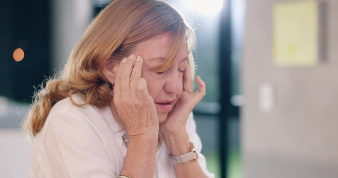 Home, stress and senior woman with a headache, anxiety and pain with tension, panic attack and dizzy. Apartment, mature person and pensioner with a migraine, temple massage and health with burnout