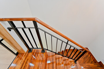 Staircase finished with red-colored wood