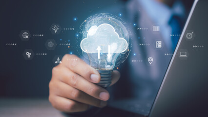 Businessman using light bulb with cloud computing. Storage technology network.
