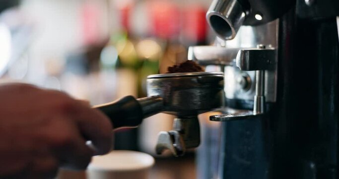 Cafe, coffee grinder and hands pouring espresso with barista, small business and hospitality. Cappuccino, ground beans and service, person in bistro or restaurant with hot drink, latte or fresh brew.