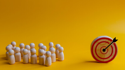 Concept of achieving goals by cooperating with team members with a human icon for customer focus...