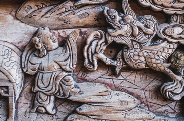 A close-up of traditional wood carving decorative patterns in ancient Chinese architecture