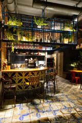 Fototapeta na wymiar Interior of a modern cozy restaurant with fresh flowers and light interior