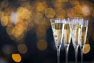 Champagne glasses on lights background