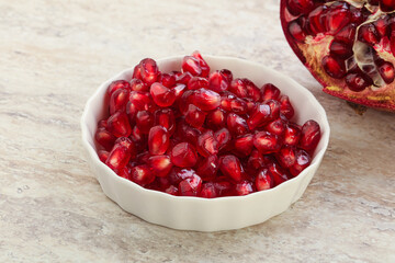 Ripe red Pomegranate seeds in the bowl
