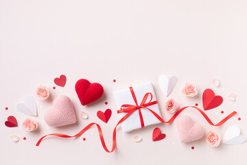Valentine or mother day festive composition with gift or present box, rose flowers and red pink...
