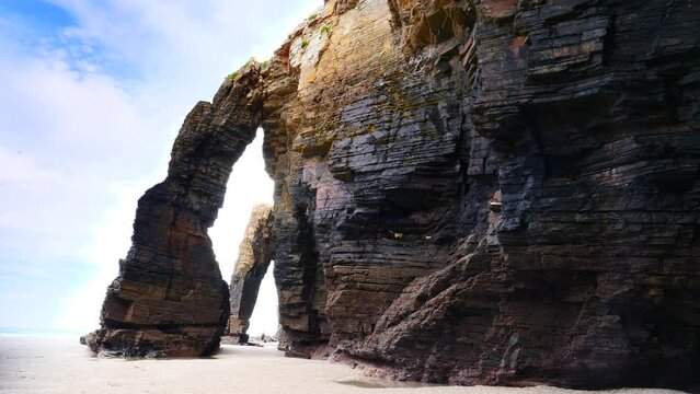 Beach of the Cathedrals, Playa las Catedrales in Ribadeo, province of Lugo, Galicia. Cliff formations on Cantabric coast in northern Spain. Tourist attraction.