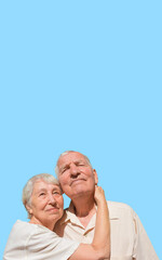 Elderly couple portrait. Isolated on blue background