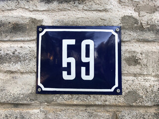 Metal numberplate that says number 59