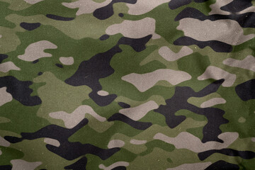 green woodeland army camouflage tarp texture , camo pattern background © eric