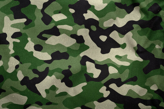 modern woodland green army camouflage tarp texture , camo fabric background