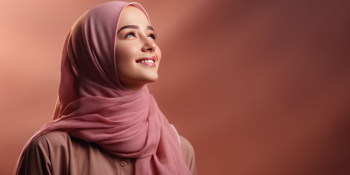 Portrait of an Arab girl wearing a beautiful modern hijab .February 1 is World Hijab Day. Banner. Copy space for text