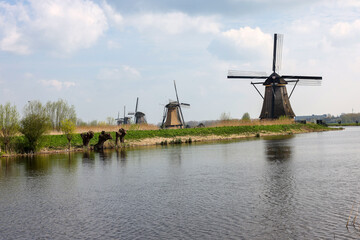 Fototapeta na wymiar The windmills at Kinderdijk, the Netherlands, a UNESCO world heritage site. Built about 1740 system19 windmills is part of a larger water management system to prevent flooding.