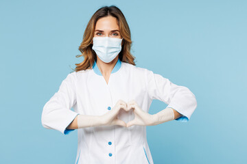Female doctor woman wears white medical gown suit mask gloves work in hospital clinic office show...