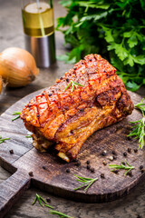 Grilled pork belly with crispy skin, with onion and herbs - obrazy, fototapety, plakaty