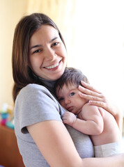 Fototapeta premium Happy smiling mother with baby