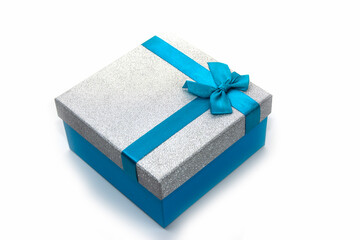 Beautiful blue gift box with a bow isolated on white. Surprise, gift, attention.